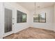 Open dining room featuring tile floors, neutral walls and a modern chandelier at 13641 W Jesse Red Dr, Peoria, AZ 85383