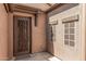 A decorative security gate encloses the front door of the home at 13641 W Jesse Red Dr, Peoria, AZ 85383