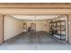 Open garage space featuring high ceilings, bright lighting, and built in storage at 13641 W Jesse Red Dr, Peoria, AZ 85383