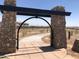 Stone-framed entrance to a walking path in the Rancho Mercado community at 14467 W Sand Hills Rd, Surprise, AZ 85387