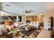 Spacious open floor plan with a living room that flows into a modern kitchen and dining area at 15613 W Minnezona Ave, Goodyear, AZ 85395