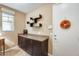 Functional mud room with ample storage, a counter, and a convenient door to the exterior at 15613 W Minnezona Ave, Goodyear, AZ 85395