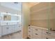Bathroom with dual vanity, open shelving, and walk-in glass shower at 16248 E Ridgeline Dr, Fountain Hills, AZ 85268