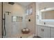 Bright bathroom featuring a frameless glass shower, mosaic tile and a double sink vanity at 16248 E Ridgeline Dr, Fountain Hills, AZ 85268