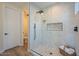 Modern bathroom featuring a frameless glass shower with mosaic tile and matte black hardware at 16248 E Ridgeline Dr, Fountain Hills, AZ 85268