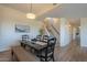 Inviting dining room featuring modern light fixture and view of stairs and upstairs hallway at 16248 E Ridgeline Dr, Fountain Hills, AZ 85268