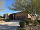 Beautiful home exterior features desert landscaping, a long driveway, and a two-car garage at 16248 E Ridgeline Dr, Fountain Hills, AZ 85268