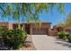 Beautiful one-story stucco home featuring desert landscaping and a spacious driveway leading to an attached two-car garage at 16248 E Ridgeline Dr, Fountain Hills, AZ 85268