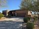 Single-Gathering home featuring desert landscaping, a three-car garage and wide driveway at 16248 E Ridgeline Dr, Fountain Hills, AZ 85268