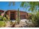 Exterior view of a charming home with desert landscaping and a two-car garage at 16248 E Ridgeline Dr, Fountain Hills, AZ 85268