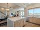 Modern kitchen with white cabinets, stainless steel appliances, and a center island that opens to the living areas at 16248 E Ridgeline Dr, Fountain Hills, AZ 85268