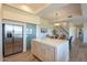 Modern kitchen with stainless steel refrigerator and glass door with quartz countertops and wooden flooring at 16248 E Ridgeline Dr, Fountain Hills, AZ 85268