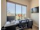 Modern home office with a spacious desk, ergonomic chair, and a large window with views at 16248 E Ridgeline Dr, Fountain Hills, AZ 85268