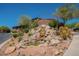 Beautiful water feature with rocky landscape and desert vegetation adds charm to the property at 16248 E Ridgeline Dr, Fountain Hills, AZ 85268