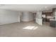 Open-concept living room showcasing tile floors, recessed lighting, and flows into the kitchen at 17794 W Getty Dr, Goodyear, AZ 85338