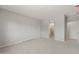 Neutral main bedroom with carpet and an open doorway leading to the main bathroom at 17794 W Getty Dr, Goodyear, AZ 85338