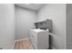 Laundry room featuring modern washer and dryer with a shelf at 17809 W Getty Dr, Goodyear, AZ 85338