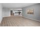Bright and airy living area with sleek floor, neutral walls and a large window offering plenty of natural light at 17809 W Getty Dr, Goodyear, AZ 85338