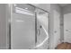 Close-up of a bathroom shower featuring white subway tiles and glass door at 17809 W Getty Dr, Goodyear, AZ 85338