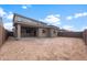 Expansive backyard featuring a covered patio and plenty of space for outdoor activities and landscaping opportunities at 17812 W Getty Dr, Goodyear, AZ 85338