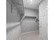 Spacious walk-in closet offering plenty of storage with built-in shelving and racks for organized clothing at 17812 W Getty Dr, Goodyear, AZ 85338