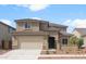 Inviting two-story home with a two car garage and desert landscaping at 17812 W Getty Dr, Goodyear, AZ 85338