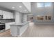 Open floor plan seamlessly connecting the kitchen to the living area at 17812 W Getty Dr, Goodyear, AZ 85338