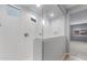 Elegant shower with glass enclosure, rainfall showerhead, and white subway tile surround at 17812 W Getty Dr, Goodyear, AZ 85338