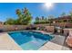 Beautiful backyard with sparkling pool, hot tub, outdoor kitchen, and basketball court at 18036 N 49Th St, Scottsdale, AZ 85254