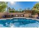 Stunning backyard featuring a luxurious pool and spa with an outdoor kitchen at 18036 N 49Th St, Scottsdale, AZ 85254
