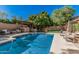 Sparkling pool with outdoor kitchen and covered seating area, ready for entertaining and summer fun at 18036 N 49Th St, Scottsdale, AZ 85254