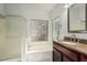 Bathroom featuring a soaking tub, separate shower, and granite counters at 18036 N 49Th St, Scottsdale, AZ 85254