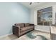 Cozy bedroom featuring a comfortable couch and a window with natural light at 18036 N 49Th St, Scottsdale, AZ 85254