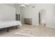 Bright and open bedroom with wood floors and archway to attached bathroom at 18036 N 49Th St, Scottsdale, AZ 85254