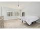 Bright bedroom featuring wood-look tile flooring, and a modern ceiling fan at 18036 N 49Th St, Scottsdale, AZ 85254