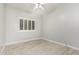 Well-lit bedroom with wood floors and a large window providing ample natural light at 18036 N 49Th St, Scottsdale, AZ 85254