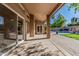Covered patio leading to a beautiful backyard with a pool, lawn, and mature trees at 18036 N 49Th St, Scottsdale, AZ 85254