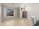Bright and inviting entryway with travertine flooring and lots of natural light from a beautiful window at 18036 N 49Th St, Scottsdale, AZ 85254