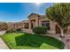 Lovely single-story home with a well-manicured front yard, complemented by mature trees and a classic design at 18036 N 49Th St, Scottsdale, AZ 85254