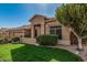 Attractive single-story home featuring a well-manicured lawn and desert landscaping at 18036 N 49Th St, Scottsdale, AZ 85254