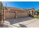 Spacious three-car garage featuring decorative windows and a basketball hoop at 18036 N 49Th St, Scottsdale, AZ 85254