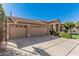 Spacious three-car garage featuring decorative windows and a basketball hoop at 18036 N 49Th St, Scottsdale, AZ 85254