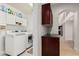 Well-lit laundry room with modern washer and dryer, plus ample storage space at 18036 N 49Th St, Scottsdale, AZ 85254