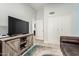 Bright living room showcasing a television and built-in storage cabinets at 18036 N 49Th St, Scottsdale, AZ 85254