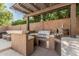 Well-equipped outdoor kitchen with a built-in grill, bar, and elegant lighting, perfect for outdoor gatherings at 18036 N 49Th St, Scottsdale, AZ 85254