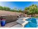 Relaxing pool area featuring a hot tub, outdoor kitchen, and comfortable seating, creating a private oasis at 18036 N 49Th St, Scottsdale, AZ 85254