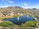 Beautiful community lake with fountains, green spaces, and mountain views in a residential neighborhood at 1961 E Stacey Rd, Gilbert, AZ 85298