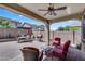 Spacious outdoor patio with ample seating, a built-in grill, and string lights, perfect for enjoying summer evenings at 1961 E Stacey Rd, Gilbert, AZ 85298