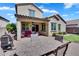 Outdoor patio with comfortable seating, a dining table, and a built-in grill, perfect for entertaining or relaxing at 1961 E Stacey Rd, Gilbert, AZ 85298