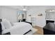 Cozy bedroom with white bedding, desk, and natural light creates a calming retreat at 1961 E Stacey Rd, Gilbert, AZ 85298